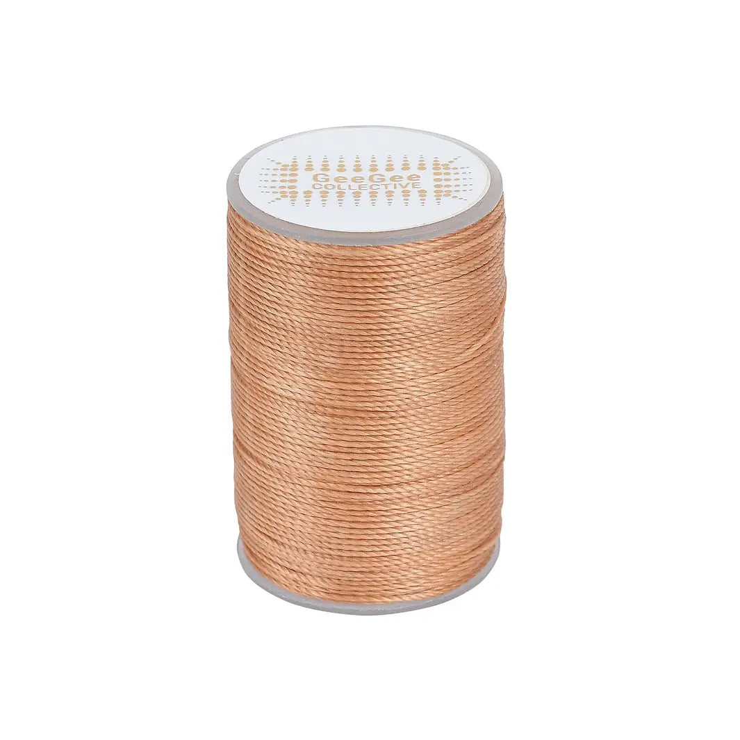Light brown horse plaiting thread spool for neat and professional plaits. Waxed for maximum grip and suitable for all equestrian grooming needs.