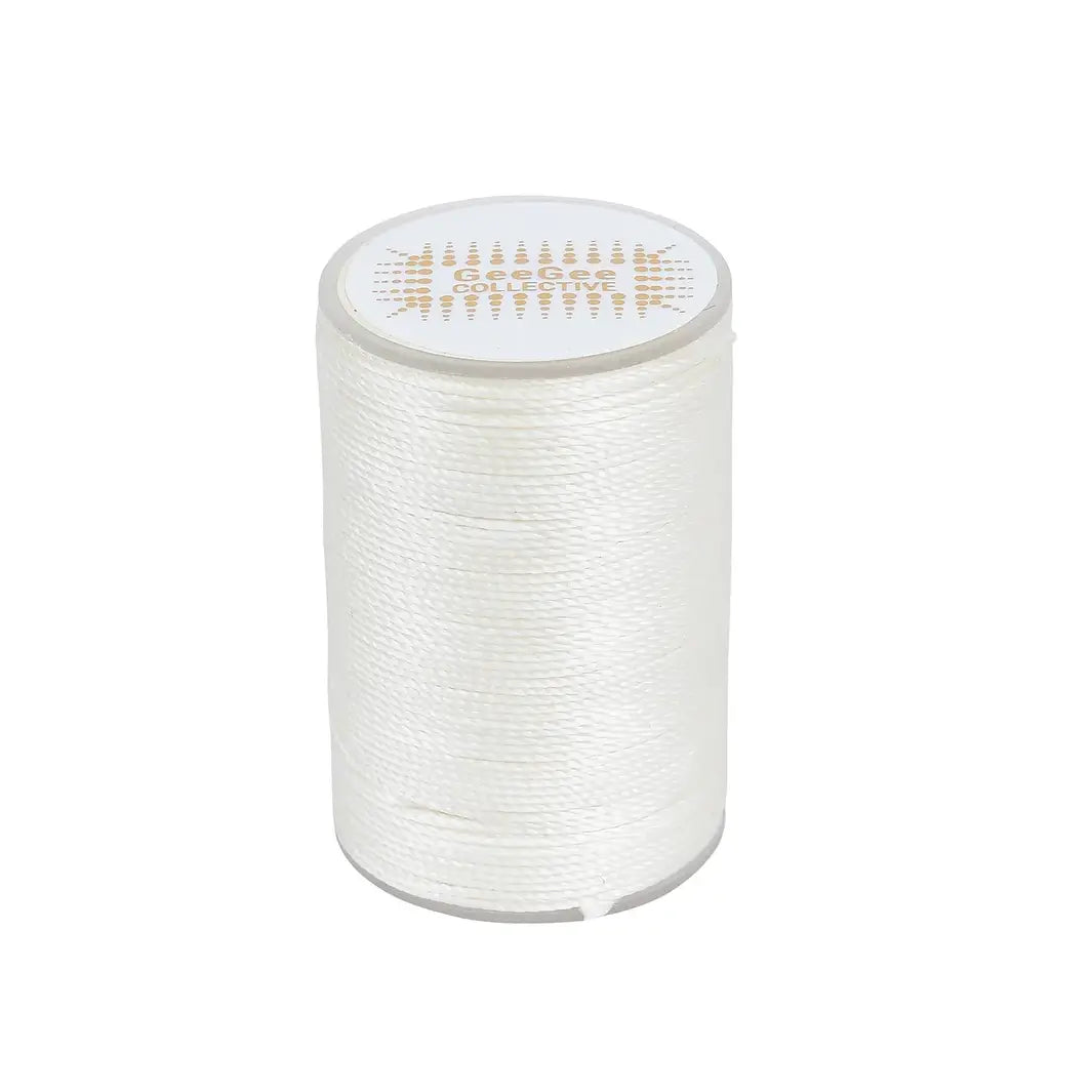 White horse plaiting thread spool for creating clean and precise plaits. Waxed finish provides excellent grip and prevents hair damage.