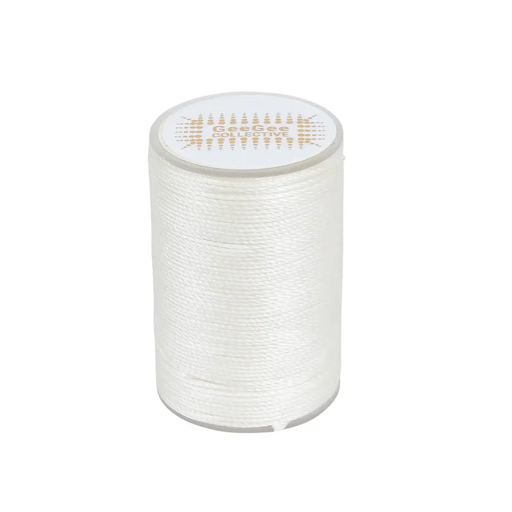 White horse plaiting thread spool for creating clean and precise plaits. Waxed finish provides excellent grip and prevents hair damage.