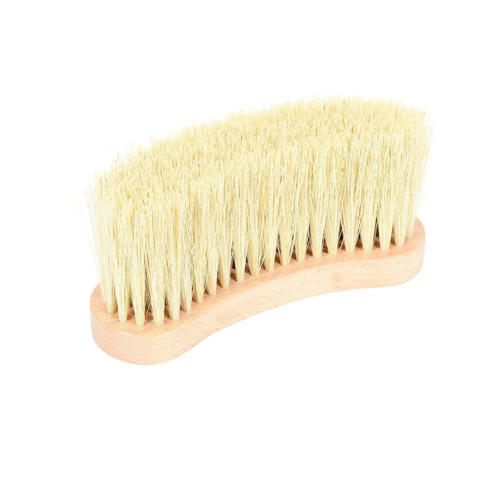 Side view of a curved wooden horse grooming brush with densely packed natural bristles for effective cleaning.