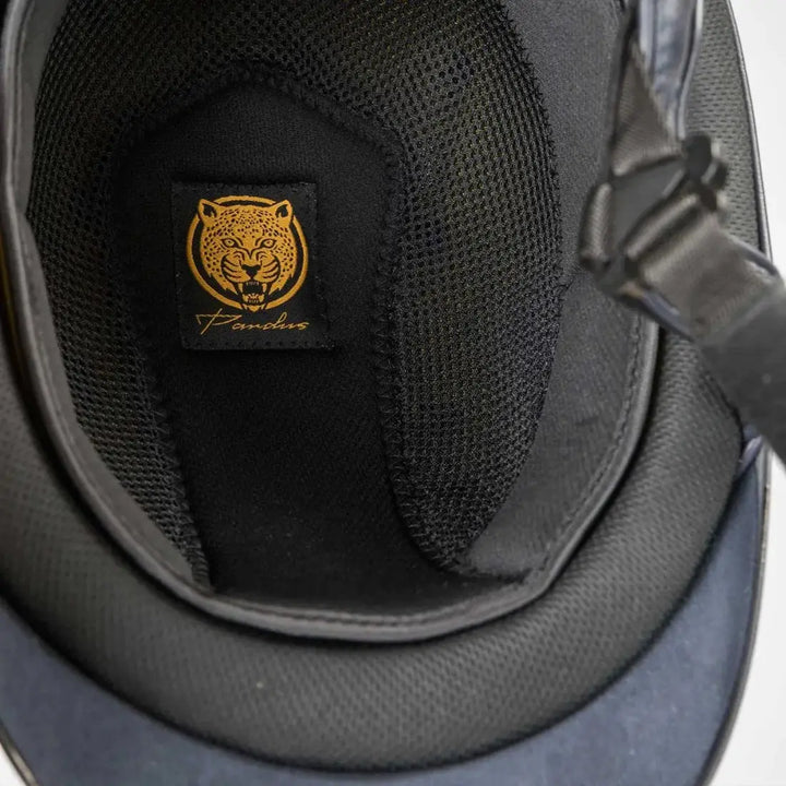 Inner padding of the Back On Track EQ3 Pardus Smooth Horse Riding Helmet with MIPS, featuring a mesh lining and the Pardus logo patch.