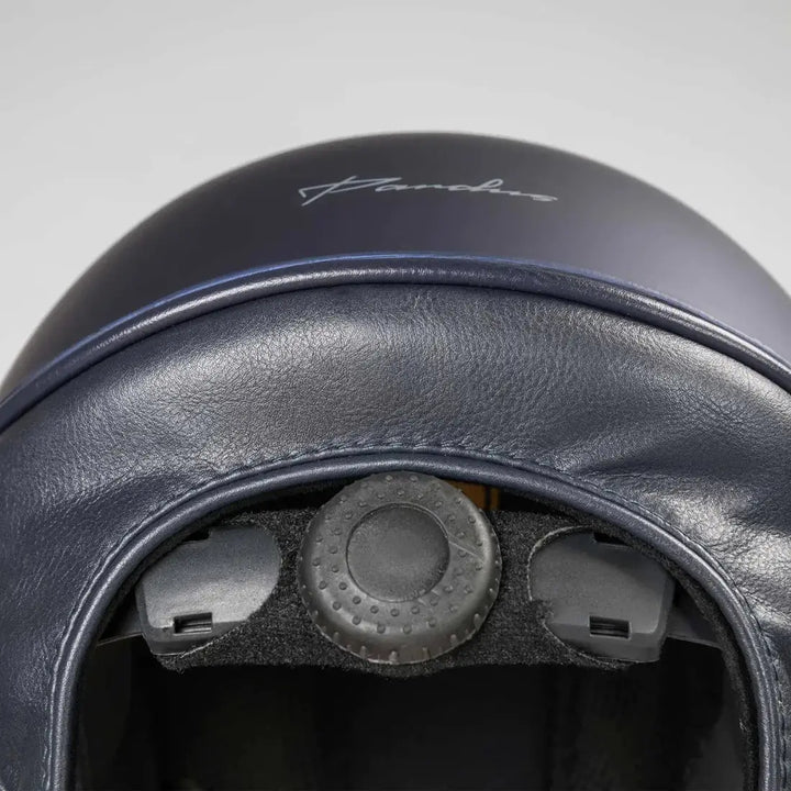 Interior view of the Back On Track EQ3 Pardus Smooth Horse Riding Helmet with MIPS in blue, showing the adjustable dial and padded lining.