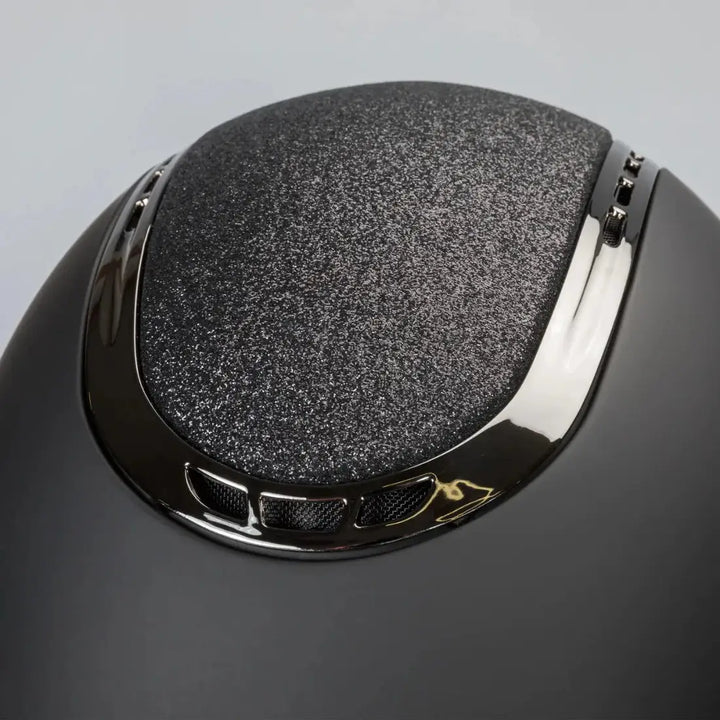 Back On Track EQ3 Pardus Smooth with Sparkle helmet featuring a matte black finish and a glittery 'Sand' accent on the top with ventilation details.