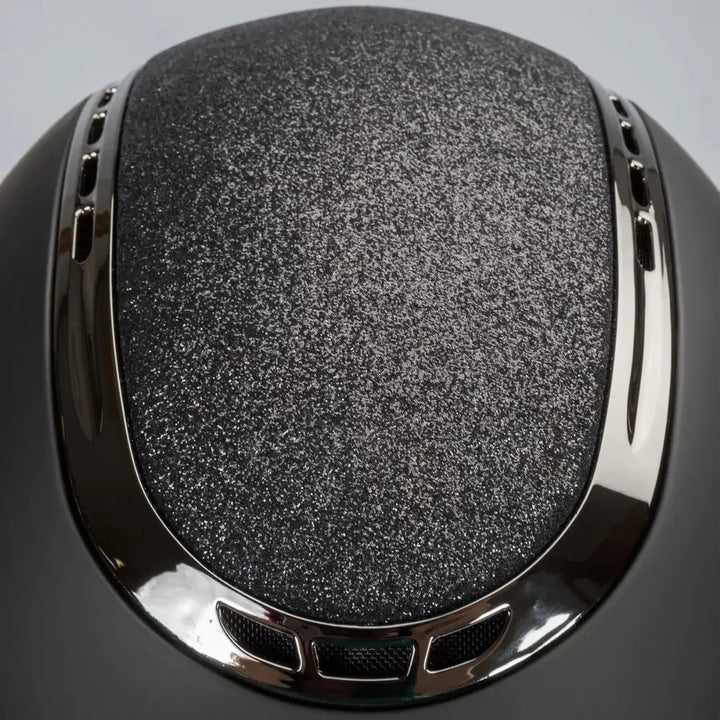 Back On Track EQ3 Pardus Smooth with Sparkle riding helmet featuring a matte black finish and a glittery 'Sand' accent on the top with chrome ventilation details.