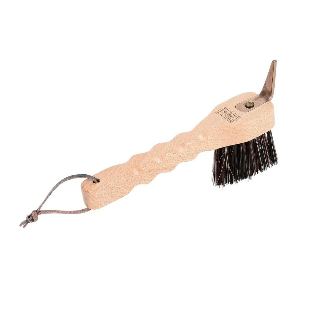 Hoof pick with a wooden handle and stiff bristles, included in the Ultimate Brush Kit for horse grooming.