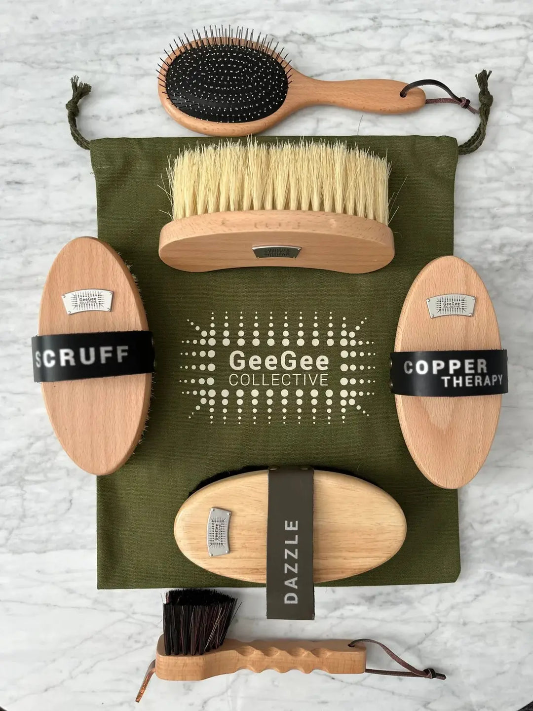 Ultimate Brush Kit featuring a 6-piece premium horse grooming set with wooden brushes and a green GeeGee Collective storage bag.
