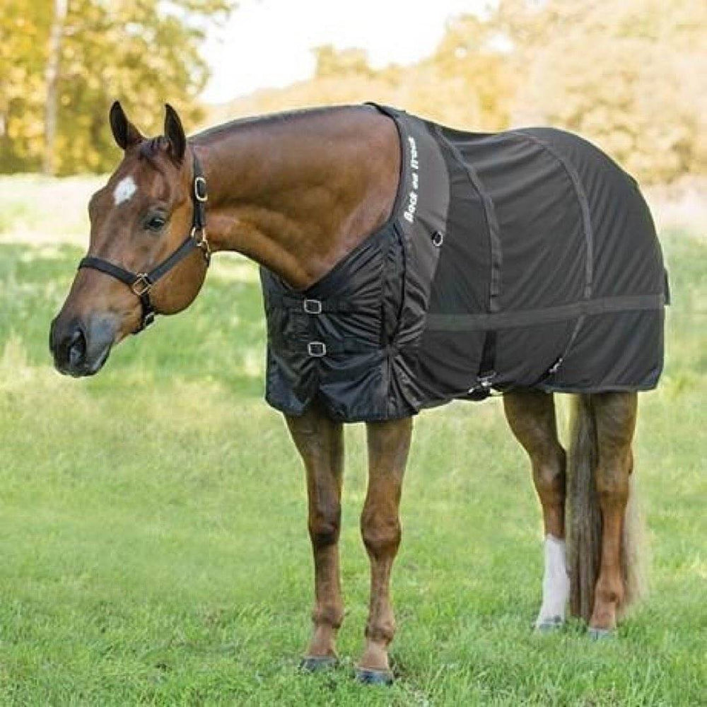 Horse wearing the Therapeutic Horse Mesh Rug by Back On Track Australia in a grassy outdoor setting, designed for muscle relief and comfort.