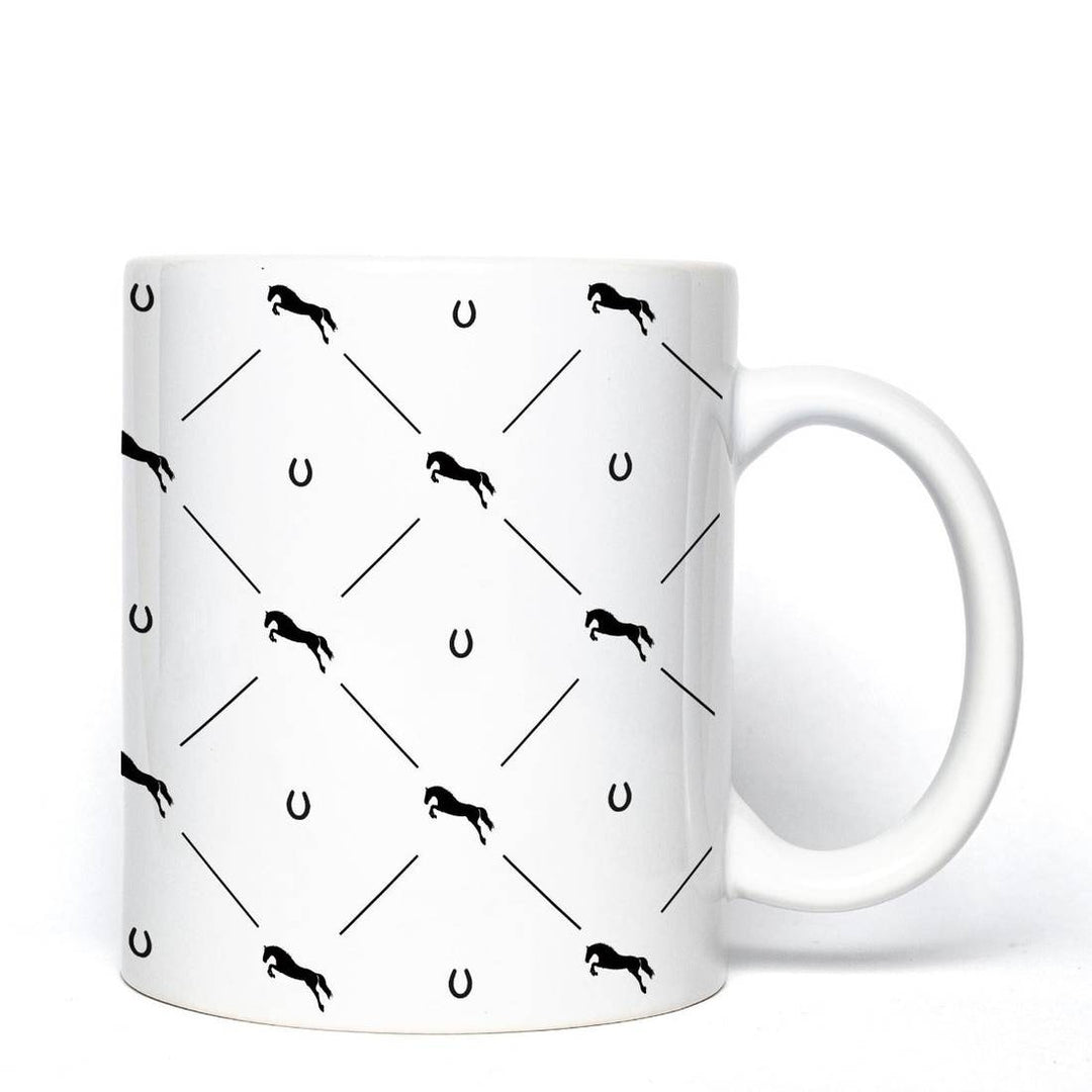 White Jumping Star Mug featuring a black horse and horseshoe pattern, perfect for equestrian enthusiasts and showjumpers.