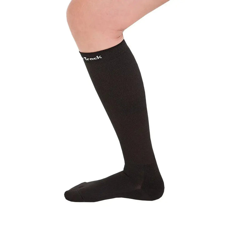 Side view of Nikki Riding Socks in black, highlighting their ergonomic fit and Welltex® technology for enhanced circulation and comfort.