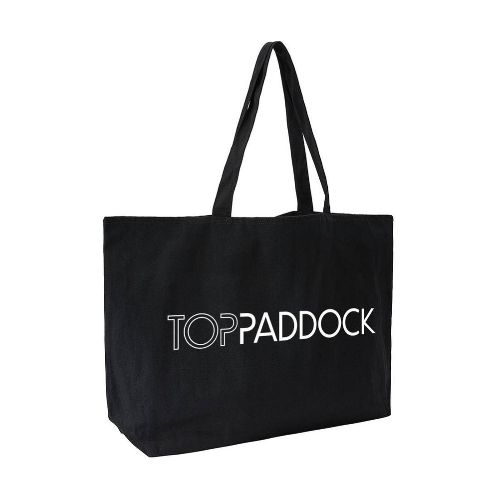 Side view of the Top Paddock Equestrian Oversized Tote Bag in black, showcasing its sturdy construction and stylish white logo.