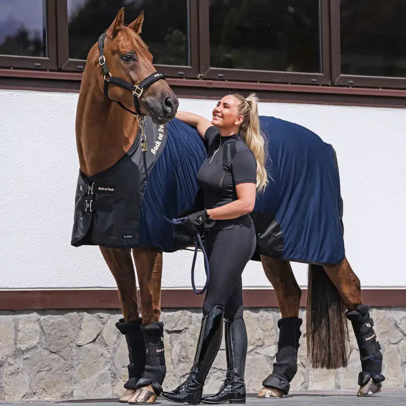 Therapeutic Deluxe Royal Horse Mesh Rug in use on a horse, with a rider showcasing its fit and comfort.