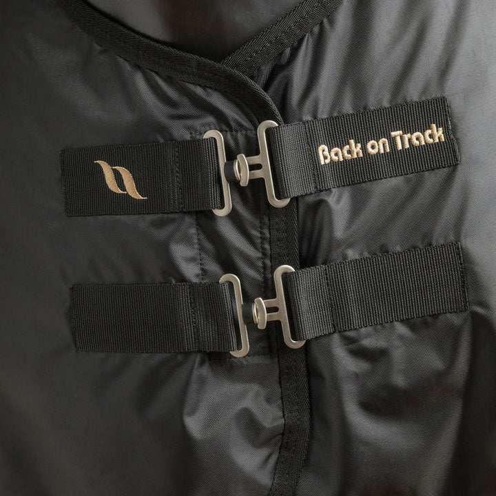 Close-up of the front buckle system on the Deluxe Royal Horse Mesh Rug, highlighting durable straps and Back On Track branding.