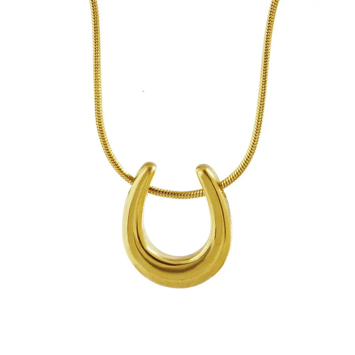 Minimalist Horseshoe Pendant Necklace in gold stainless steel with sleek snake chain, ideal equestrian gift for everyday wear.