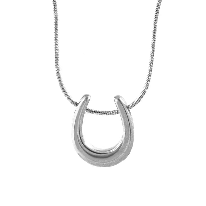 Minimalist Horseshoe Pendant Necklace in stainless steel with a sleek, curved design. Ideal equestrian gift, tarnish-resistant and lightweight.