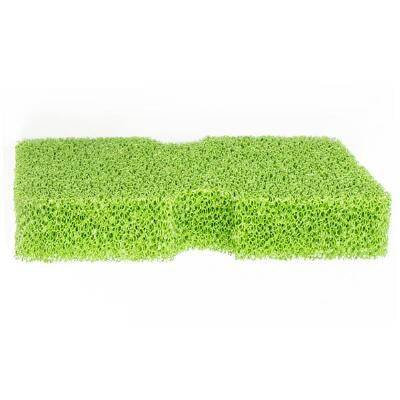 Green Tacknology Advanced Tack Sponge with a textured surface for cleaning horse tack, designed for durability and effective grime removal.