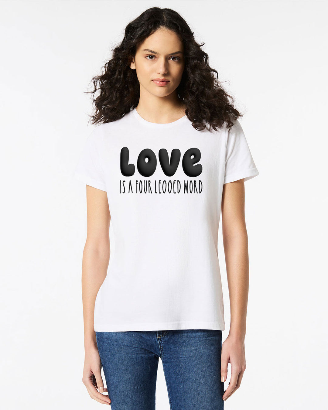 Model wearing the Love Is A Four Legged Word Tee in white with bold black puffy print text, styled for animal lovers.