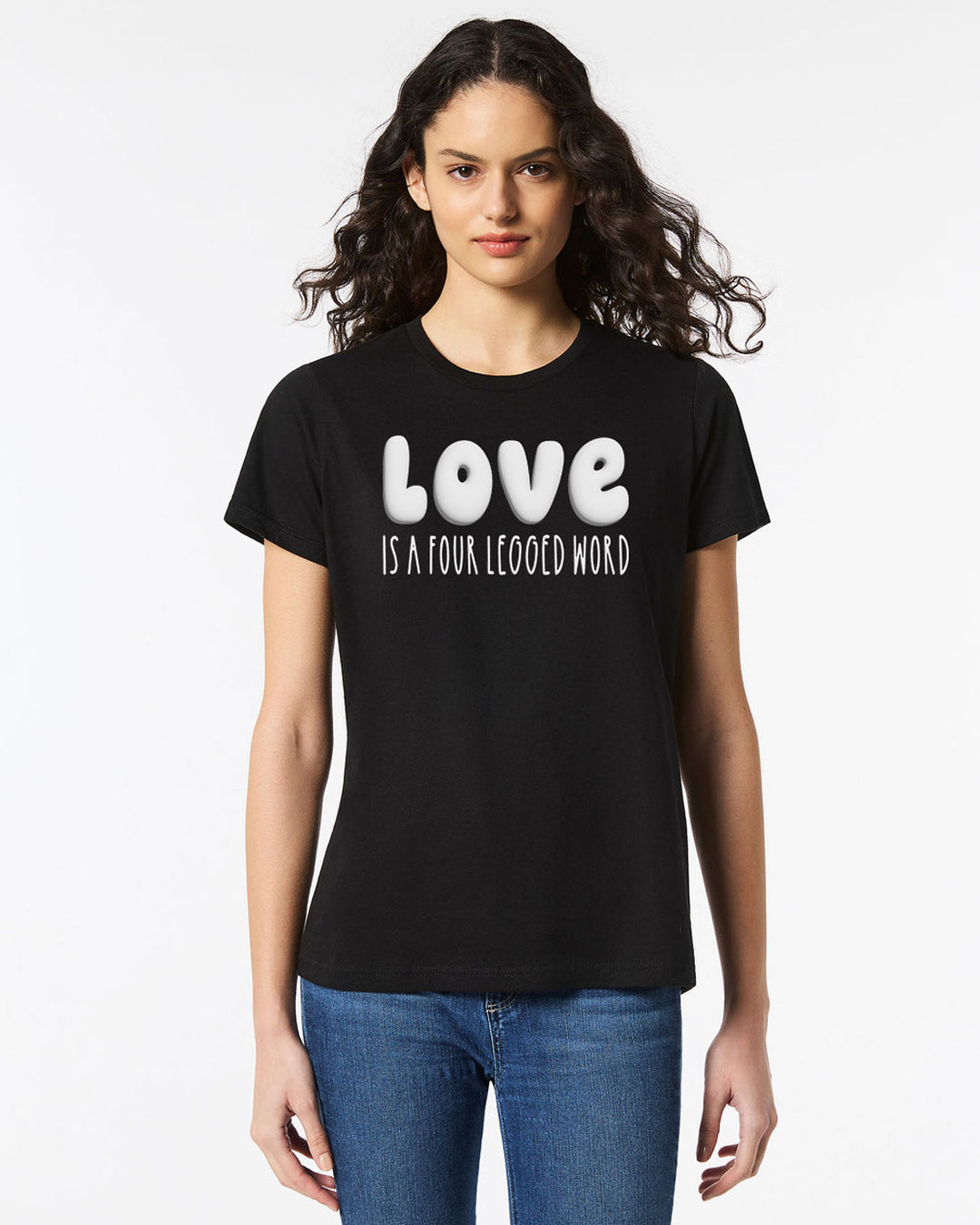 Model wearing the Love Is A Four Legged Word Tee in black with bold white puffy print text, perfect for casual outings.